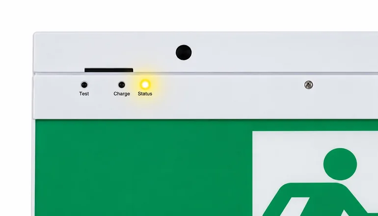 Exit sign indicator panel with the yellow LED lit